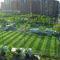 หญ้าเทียมสนามฟุตบอลเนอสเซอรี่กลางแจ้งสนามพีอี 50 มม. สีเขียว